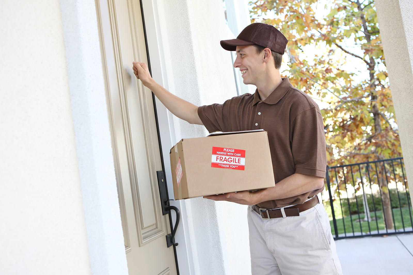 Custom packaging boxes - delivery man delivering a package