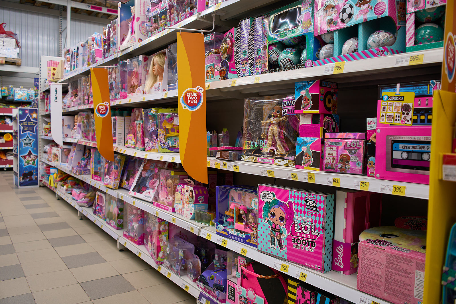 custom cardboard boxes - Shelf with many colored toys